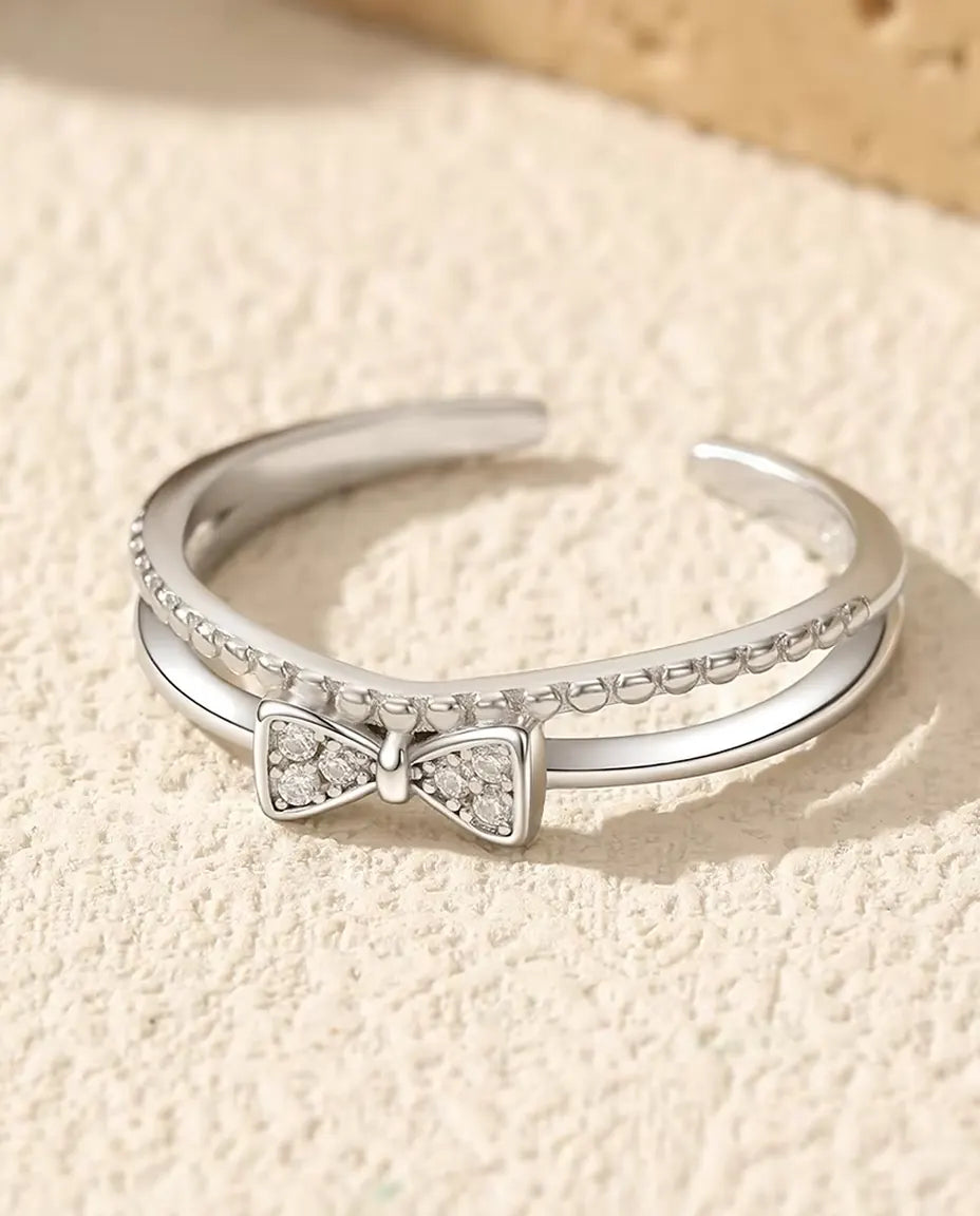 Bague Nœud Zircone - nœud pavé de 3,5 x 7 mm sur un double anneau à fil perlé, réglable, argent 925, US 6 à 9