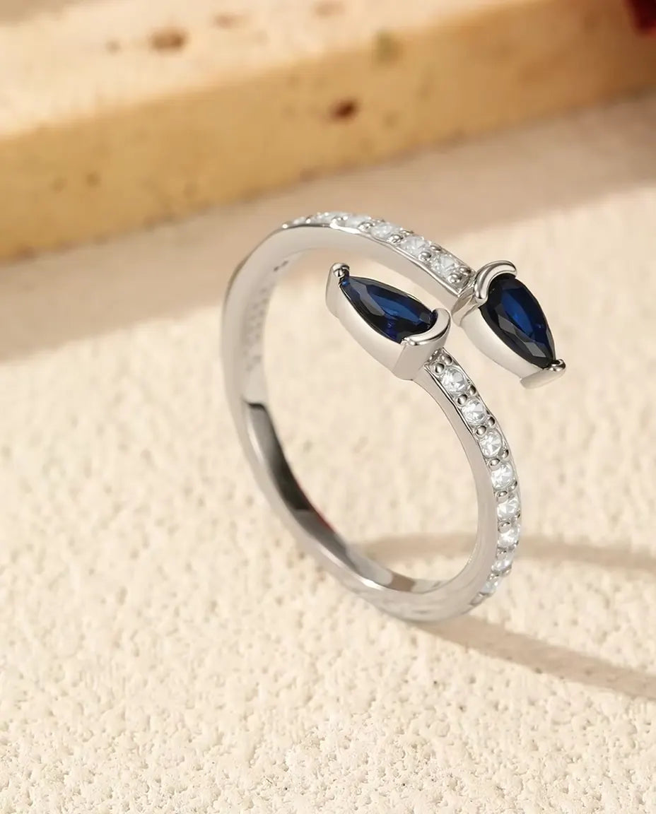 Bague Ouverte Poires Bleues - Deux pierres taille poire sur anneau pavé ouvert, argent 925, ajustable
