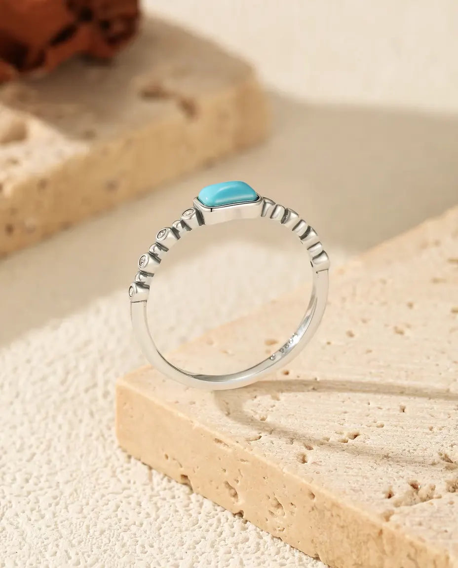 Bague Turquoise - cabochon rectangulaire sur anneau perlé serti de zircons, tailles 5 à 9, argent 925