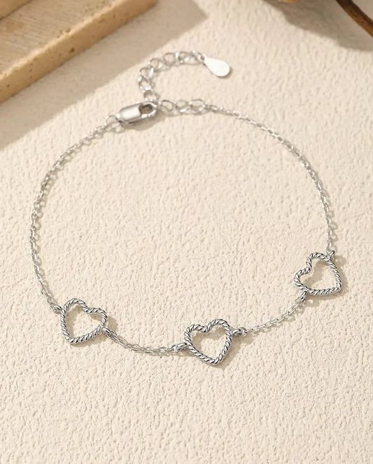 Bracelet Cœurs - trois cœurs ouverts de 8 mm en argent torsadé sur chaîne forçat en argent 925, 16 cm plus rallonge de 3 cm