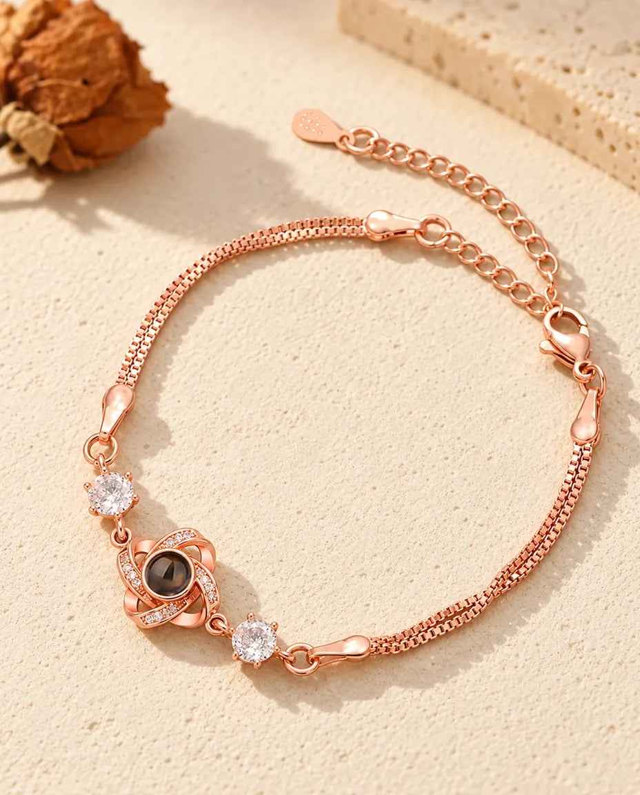 Bracelet nœud d'amour couleur or rose avec pierres latérales et double chaîne vénitienne