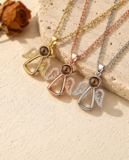 Pendentifs ange doré, couleur or rose et argenté alignés
