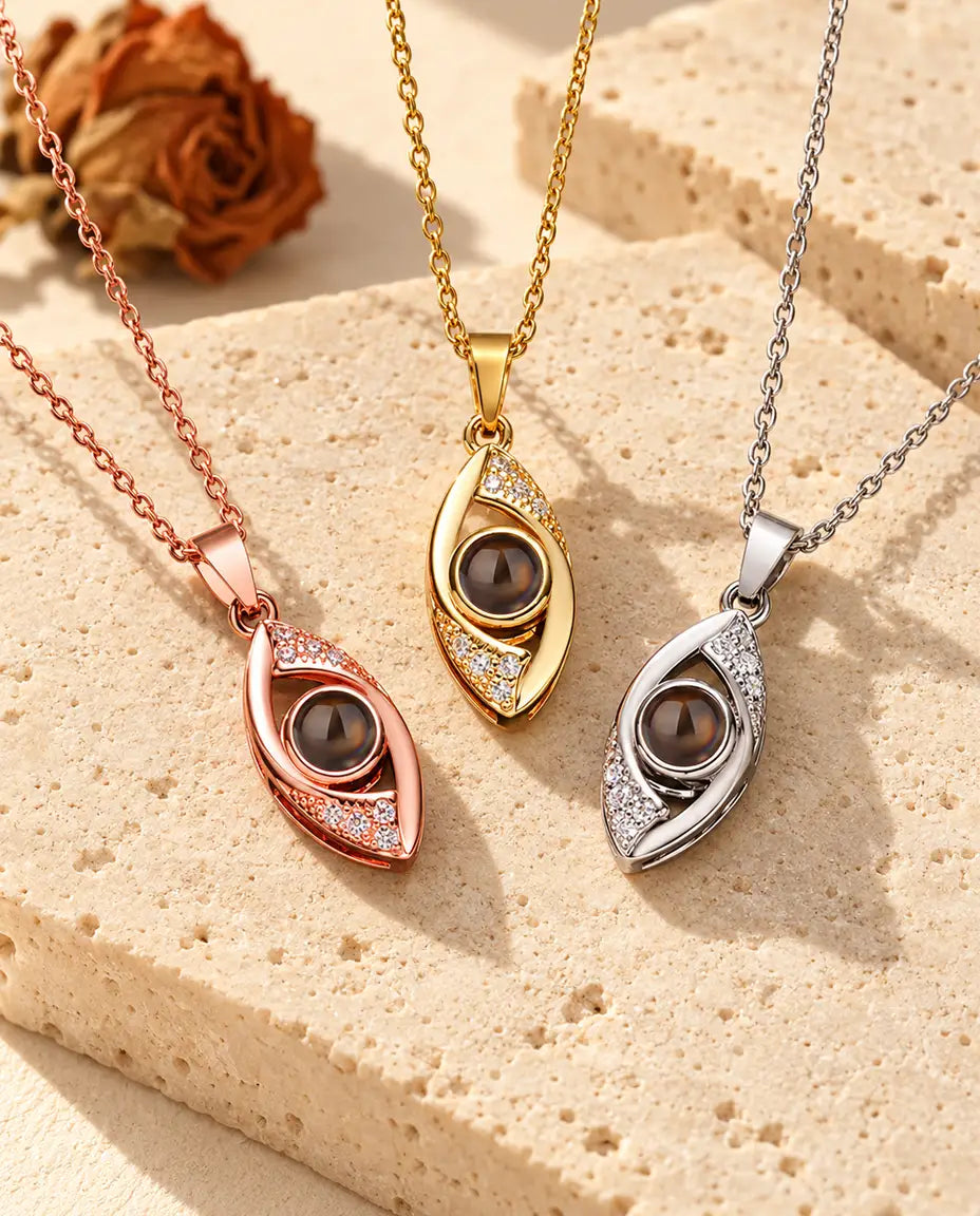 Pendentifs œil en amande couleur or rose, doré et argenté côte à côte