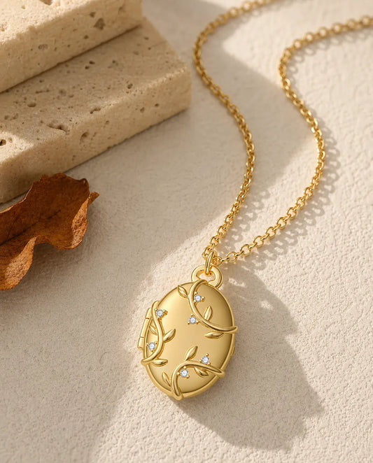 Médaillon ovale personnalisé avec 2 photos – relief rameau et cristaux, collier doré